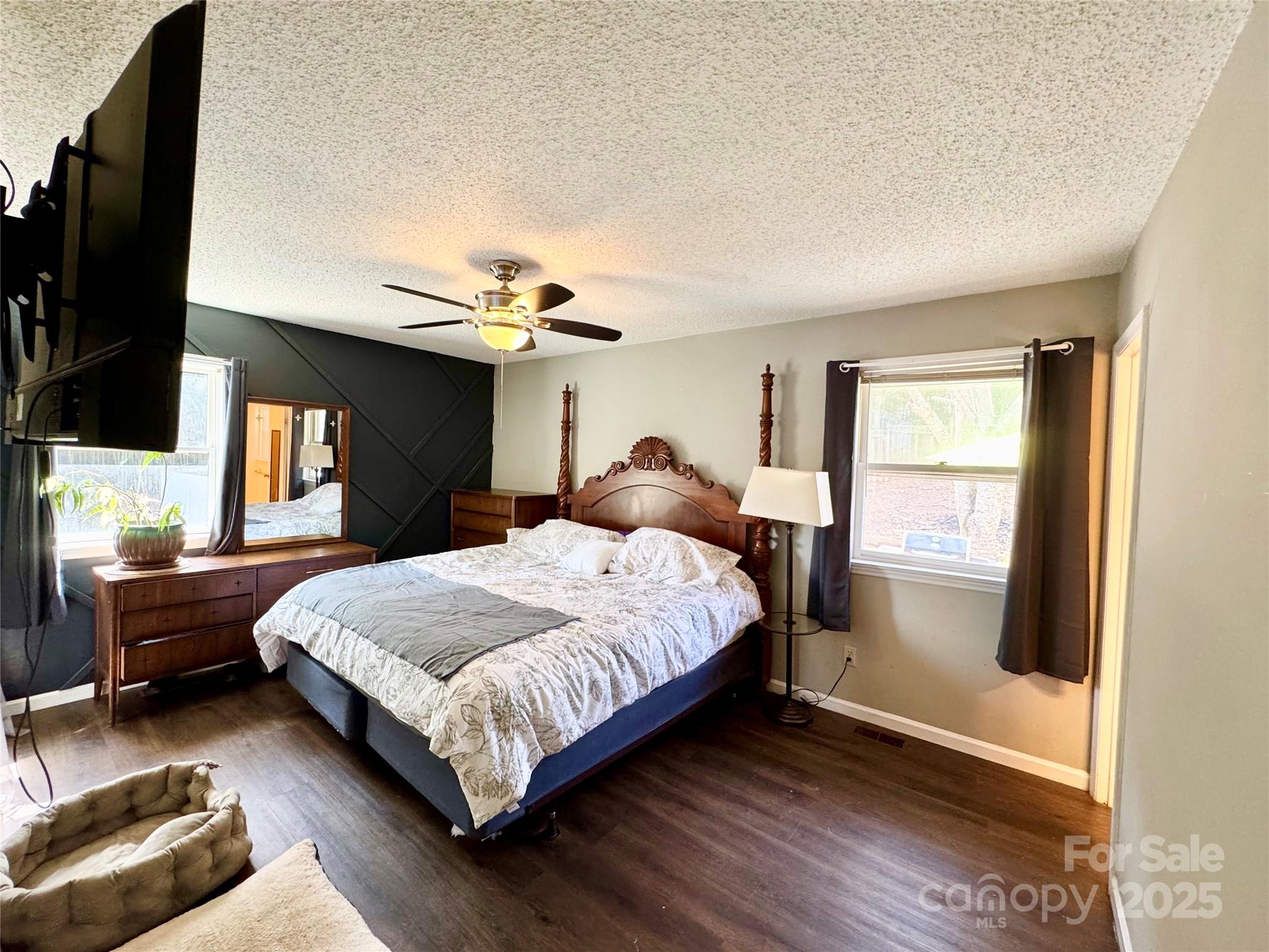 1 Spring Valley Drive Arden, NC 28704 - Photo 16 of 39 a bedroom with a large bed and a window