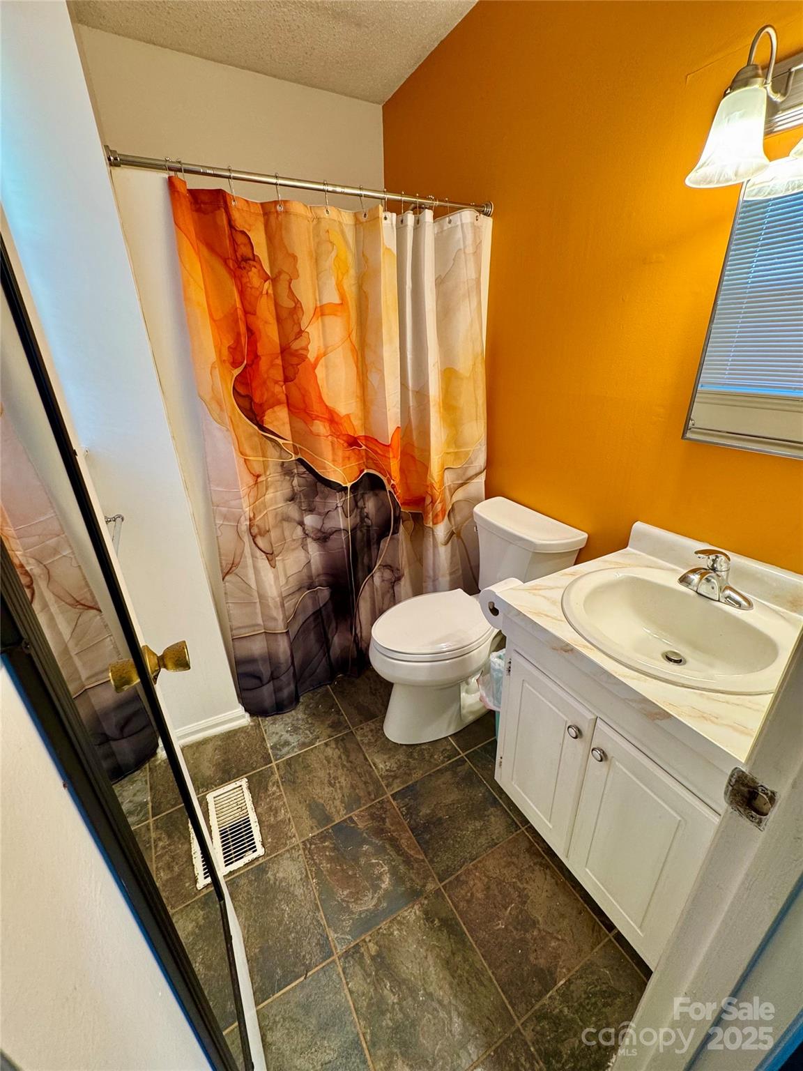 1 Spring Valley Drive Arden, NC 28704 - Photo 18 of 39 a bathroom with a sink toilet and shower