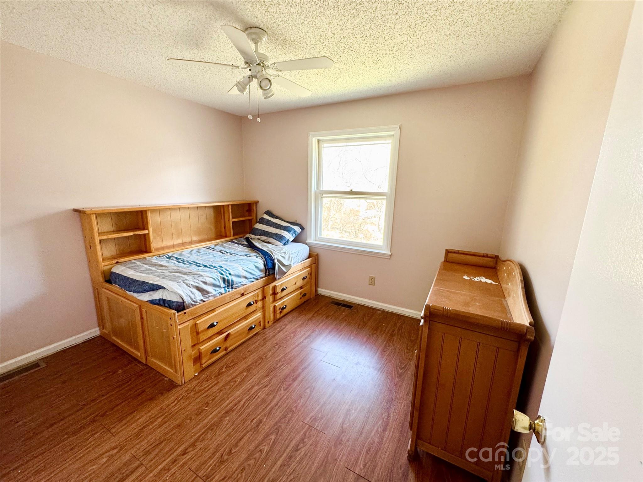 1 Spring Valley Drive Arden, NC 28704 - Photo 19 of 39 a living room with a bed and a window