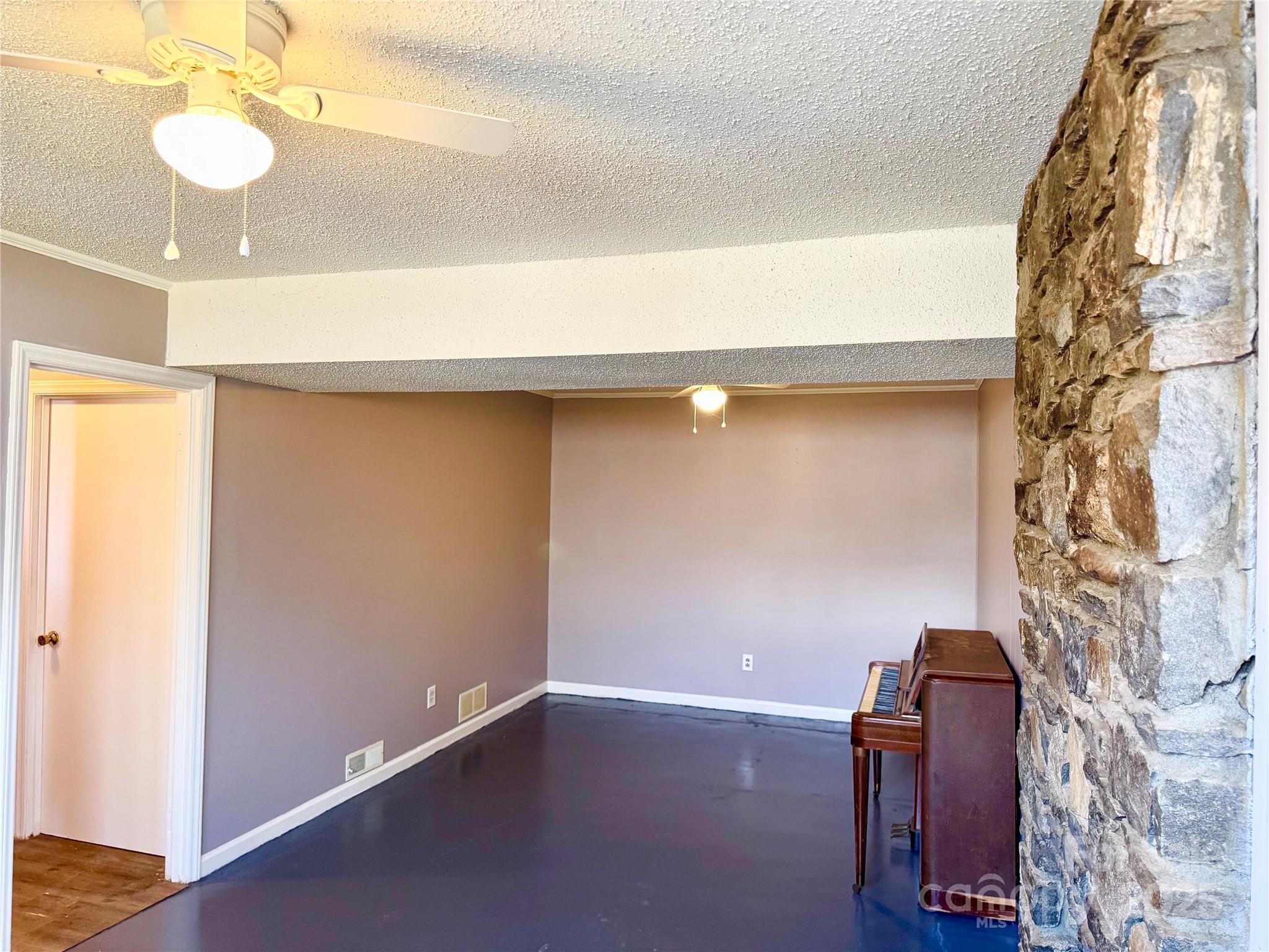 1 Spring Valley Drive Arden, NC 28704 - Photo 25 of 39 a room with a mirror and a fan