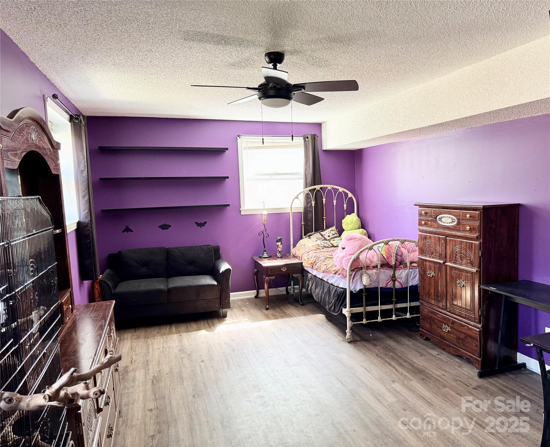 1 Spring Valley Drive Arden, NC 28704 - Photo 27 of 39 a bedroom with a bed and a book shelf