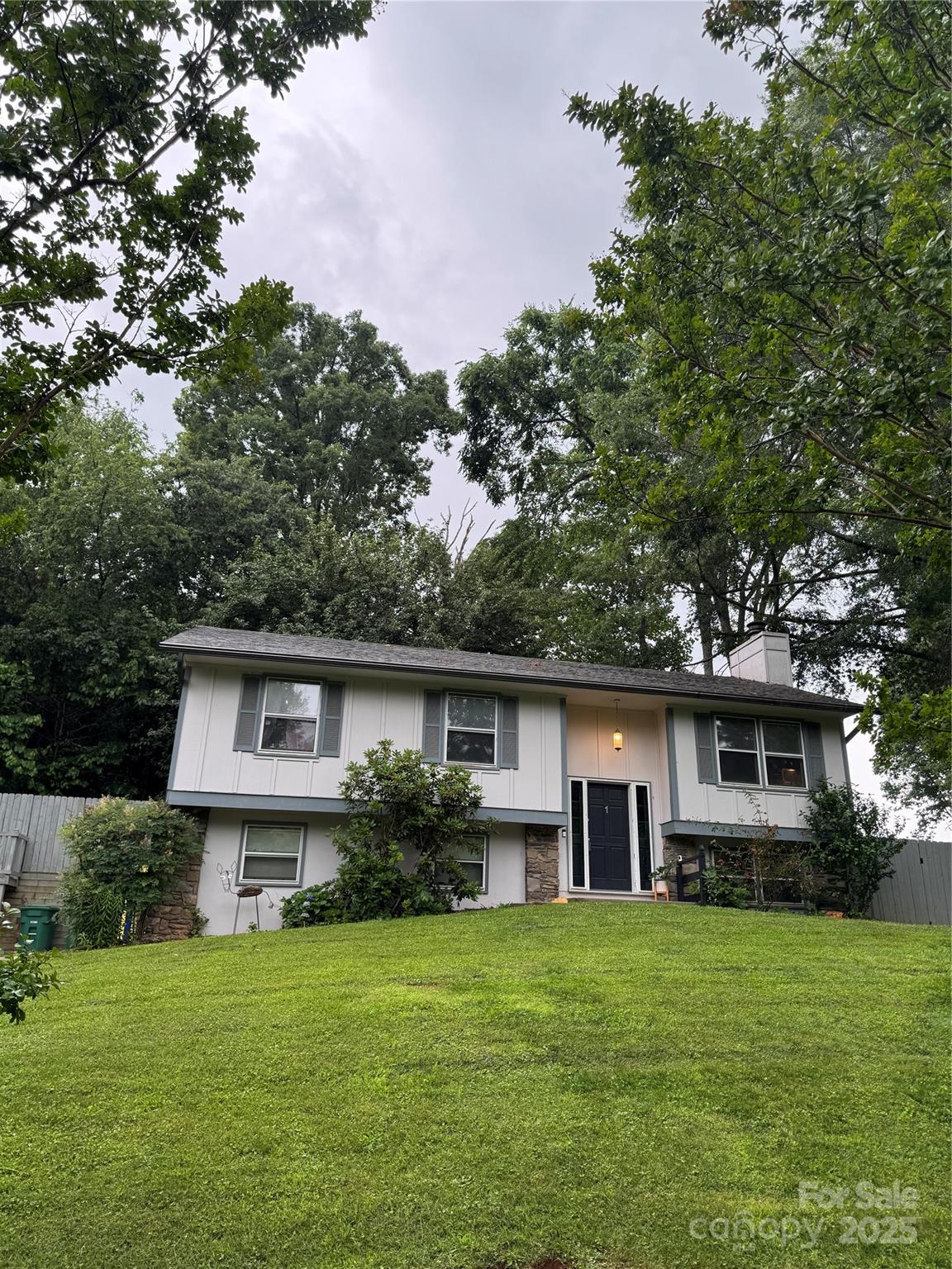 1 Spring Valley Drive Arden, NC 28704 - Photo 3 of 39 a front view of a house with a garden