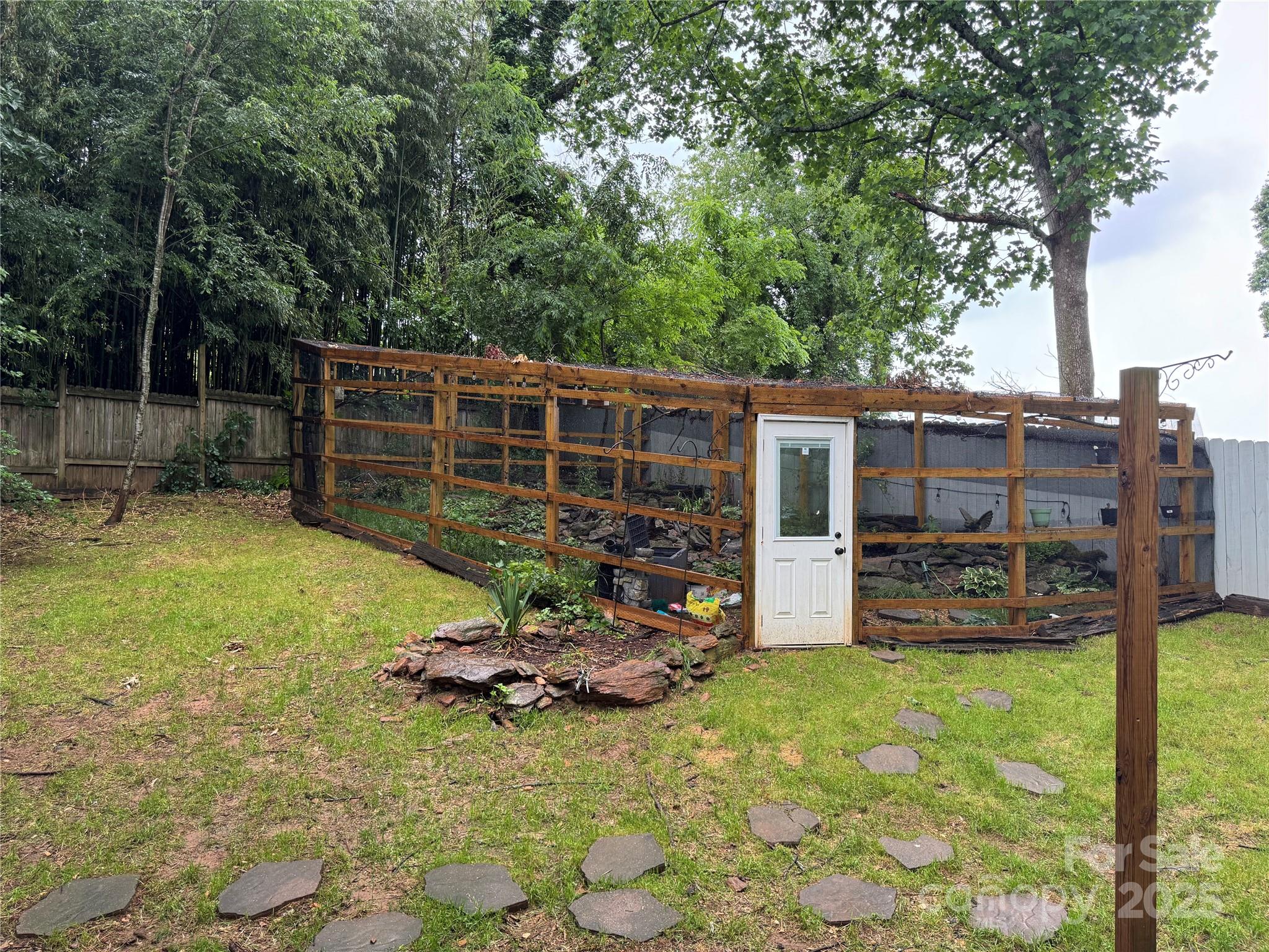 1 Spring Valley Drive Arden, NC 28704 - Photo 33 of 39 a view of a chair and table in backyard