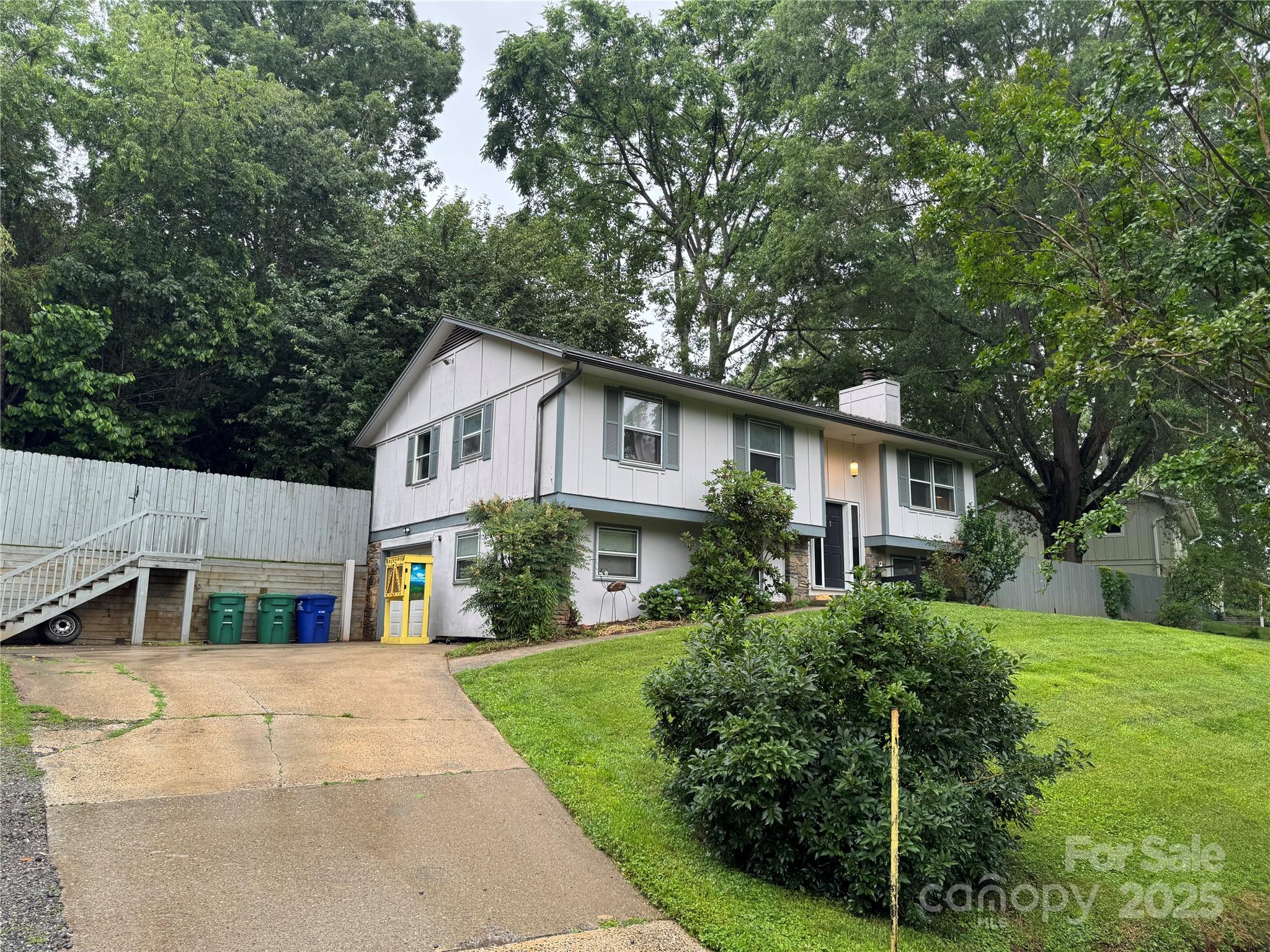 1 Spring Valley Drive Arden, NC 28704 - Photo 4 of 39 a front view of a house with a yard