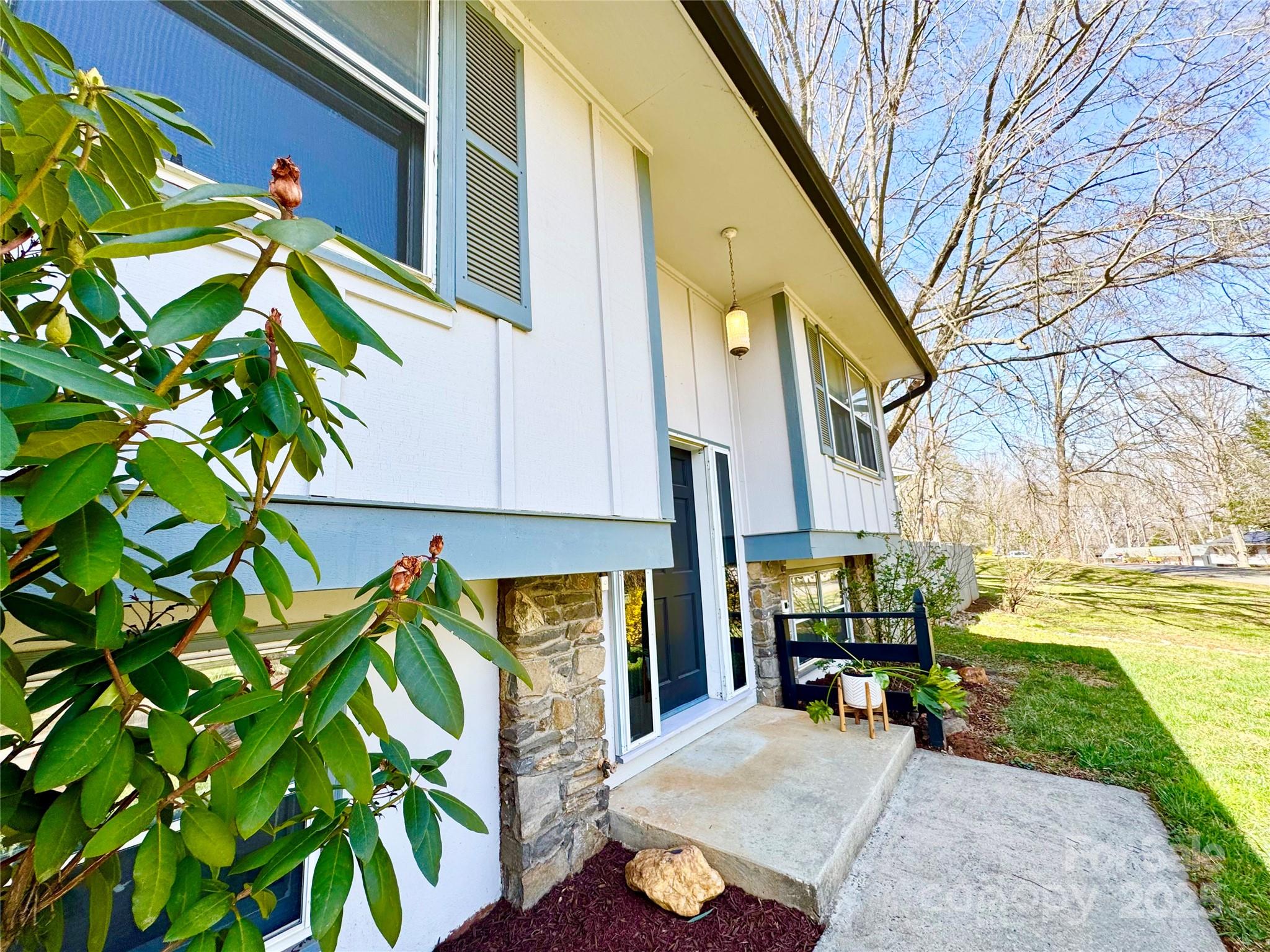 1 Spring Valley Drive Arden, NC 28704 - Photo 7 of 39 a view of a building with a potted plant