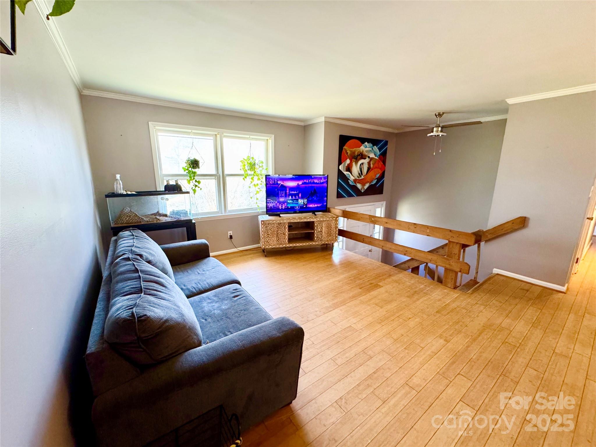 1 Spring Valley Drive Arden, NC 28704 - Photo 8 of 39 a living room with furniture gym equipment and a window