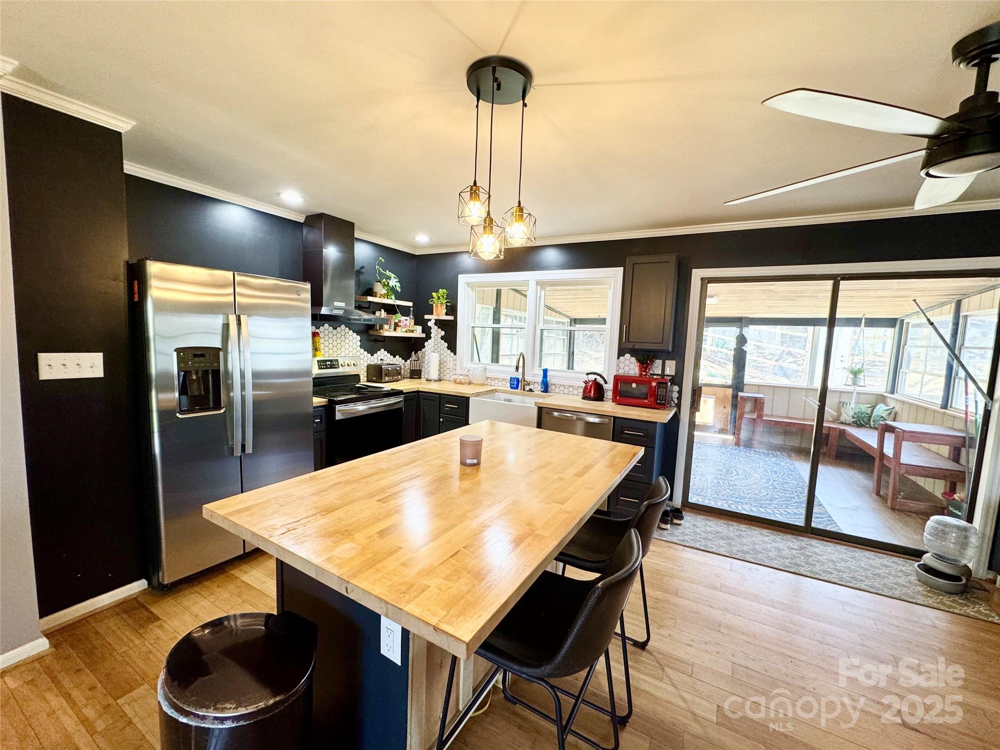 1 Spring Valley Drive Arden, NC 28704 - Photo 10 of 39 a kitchen with stainless steel appliances granite countertop a sink dishwasher and a refrigerator with wooden floor