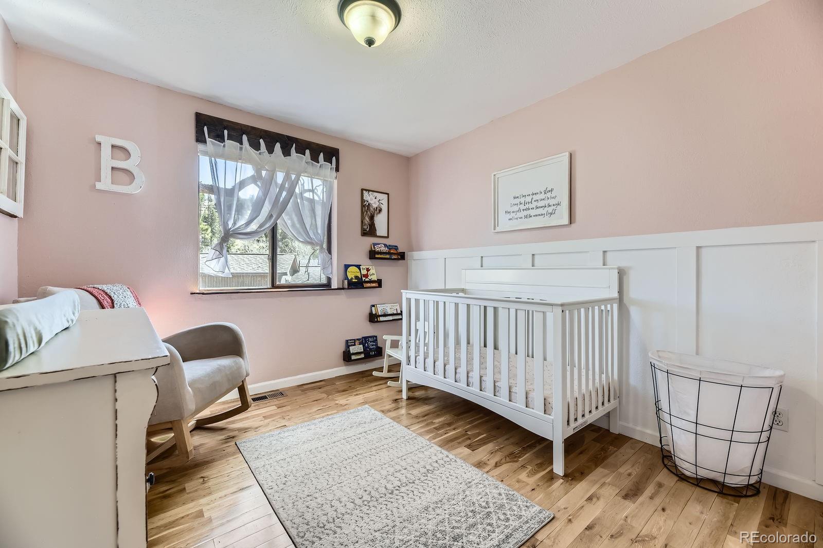 49 Silver Springs Road Bailey, CO 80421 - Photo 18 of 34 a bedroom with furniture and a window
