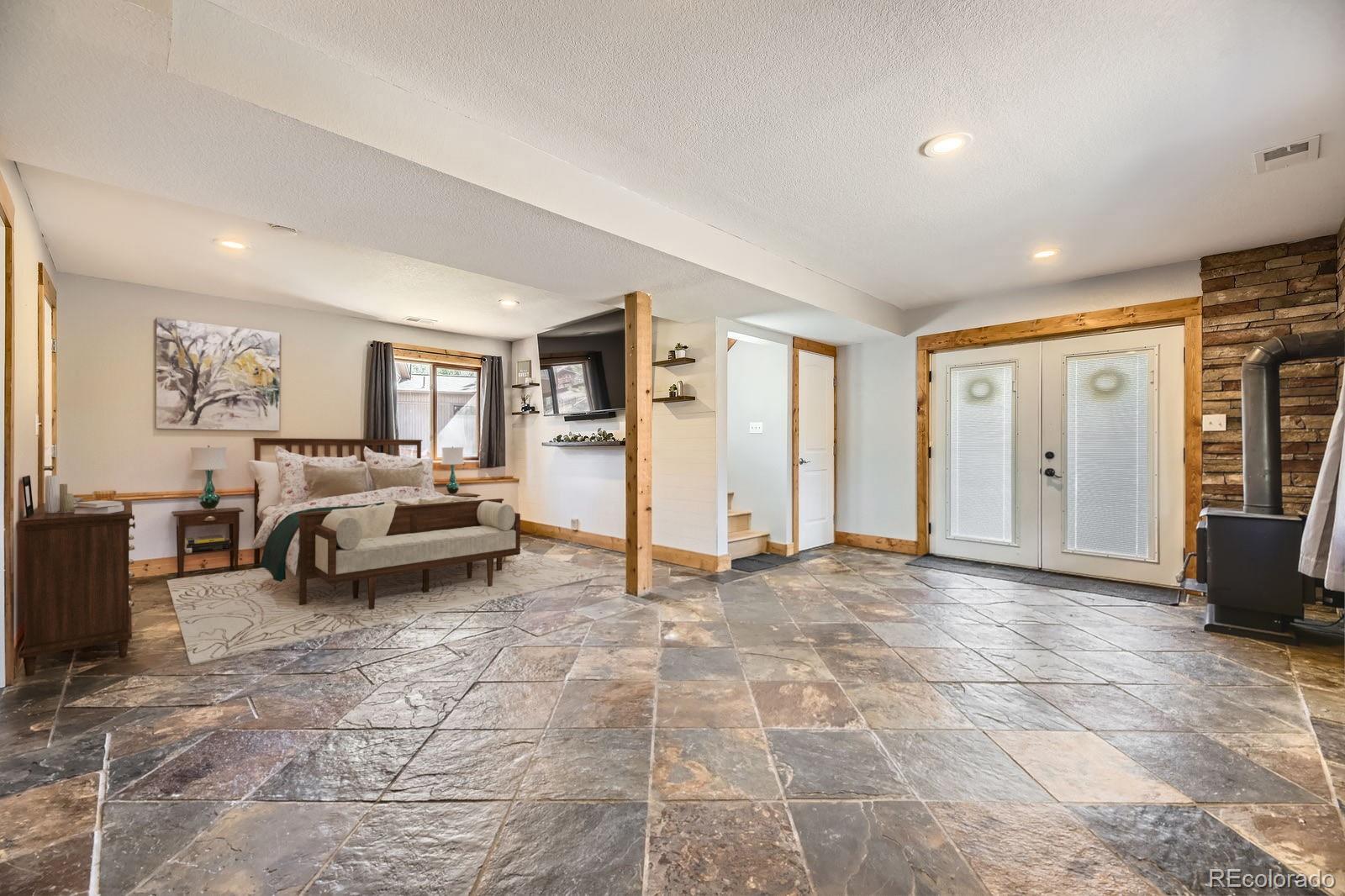49 Silver Springs Road Bailey, CO 80421 - Photo 19 of 34 a view of a livingroom with furniture and windows