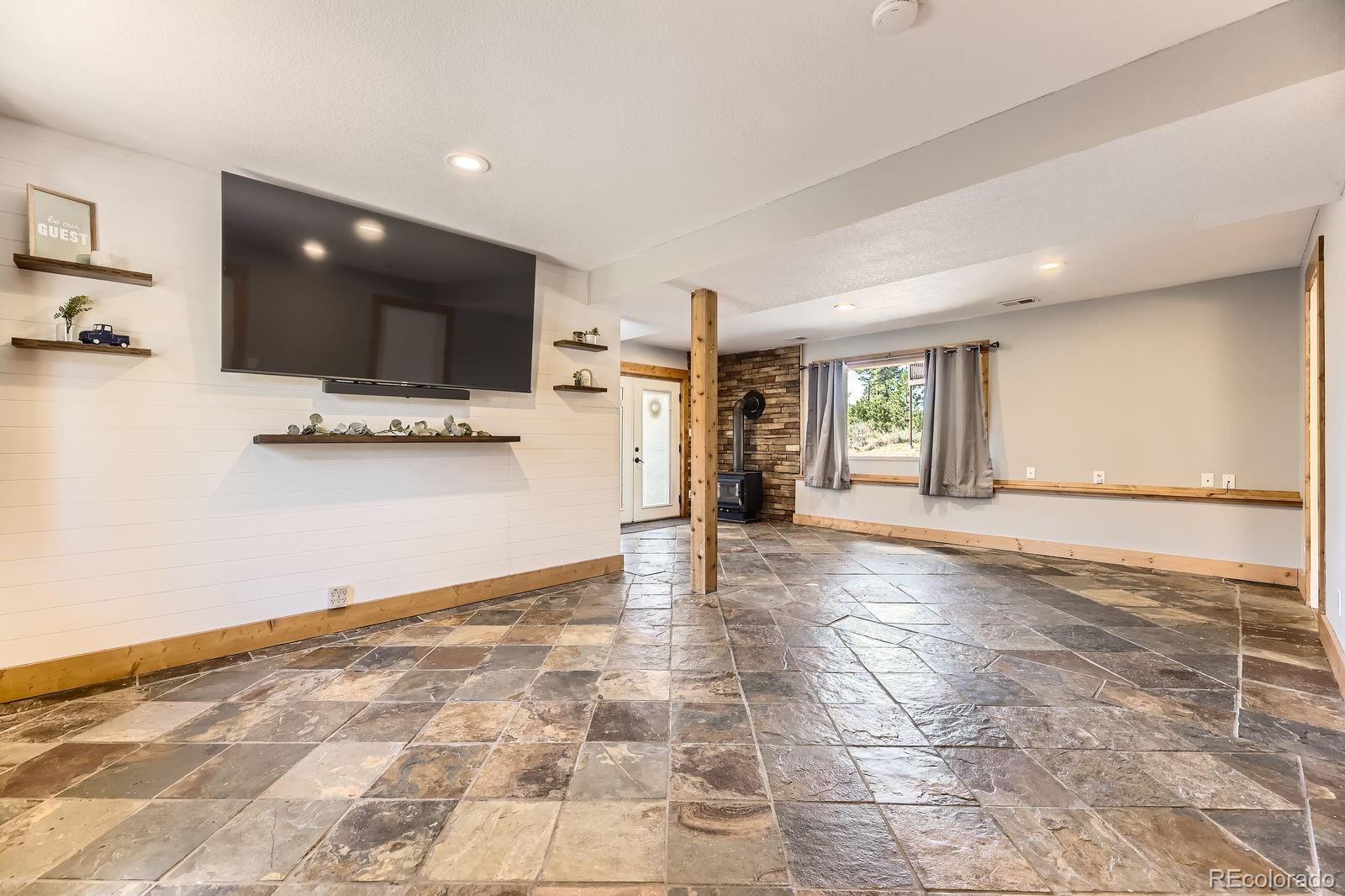 49 Silver Springs Road Bailey, CO 80421 - Photo 24 of 34 a view of a kitchen with a sink and a window