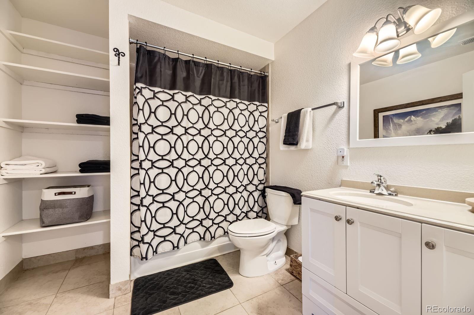 49 Silver Springs Road Bailey, CO 80421 - Photo 26 of 34 a bathroom with a sink toilet and shower