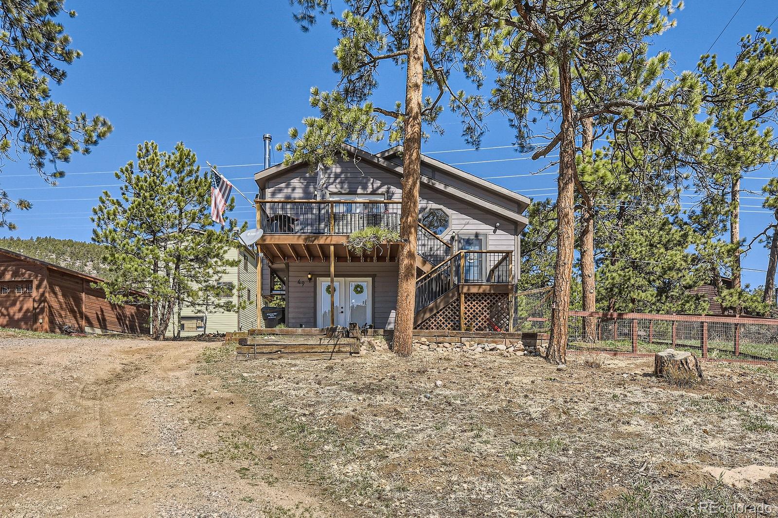 49 Silver Springs Road Bailey, CO 80421 - Photo 4 of 34 a view of a house with a snow on the yard