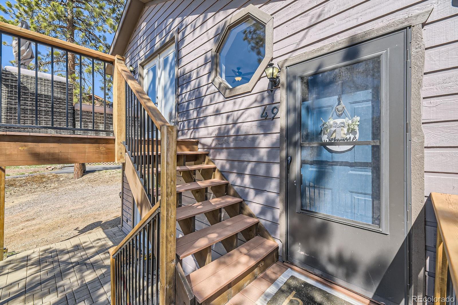 49 Silver Springs Road Bailey, CO 80421 - Photo 5 of 34 a view of balcony with wooden floor