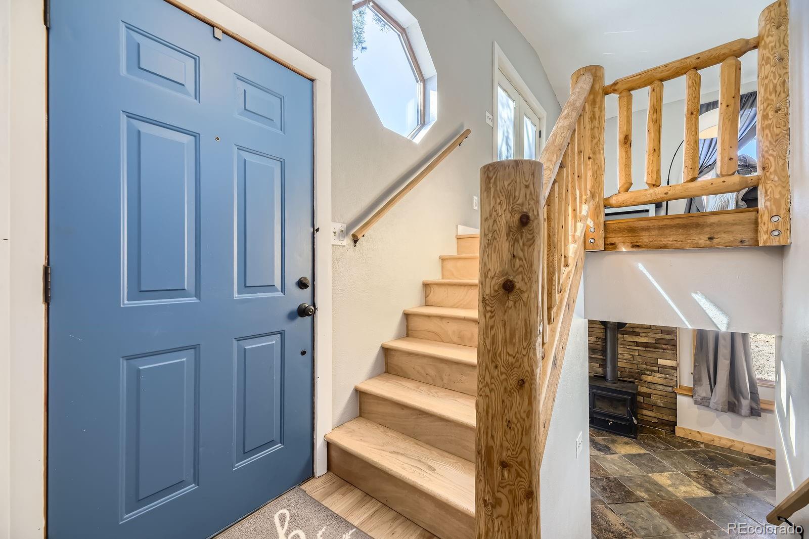 49 Silver Springs Road Bailey, CO 80421 - Photo 6 of 34 a view of entryway and hall with wooden floor
