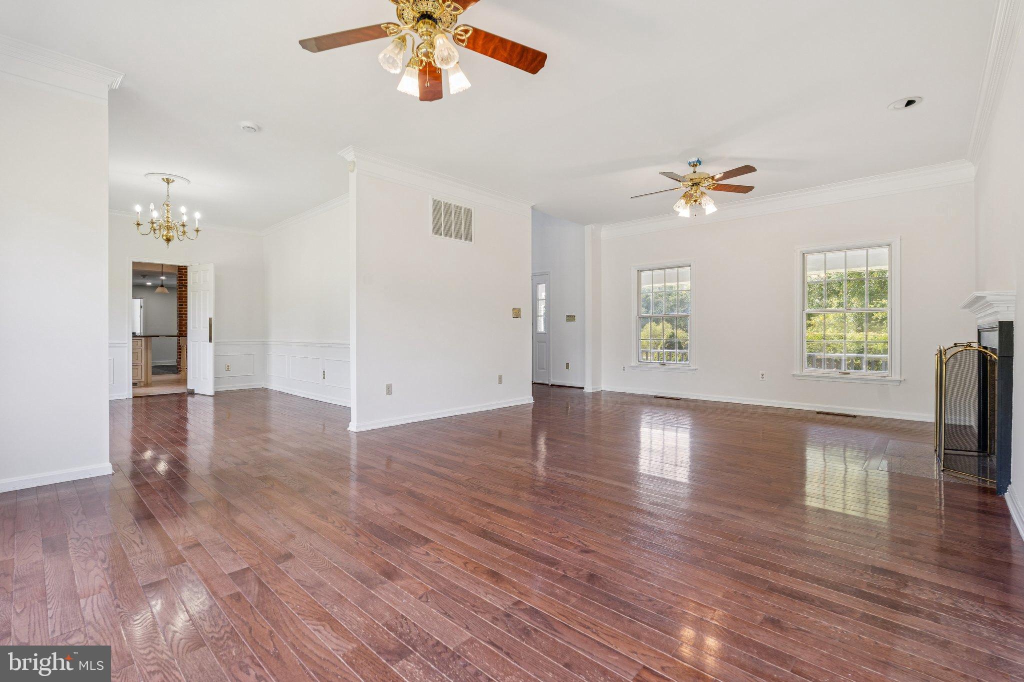 12212 Mt Albert Road Ellicott City, MD 21042 - Photo 12 of 58 wooden floor in an empty room with a window