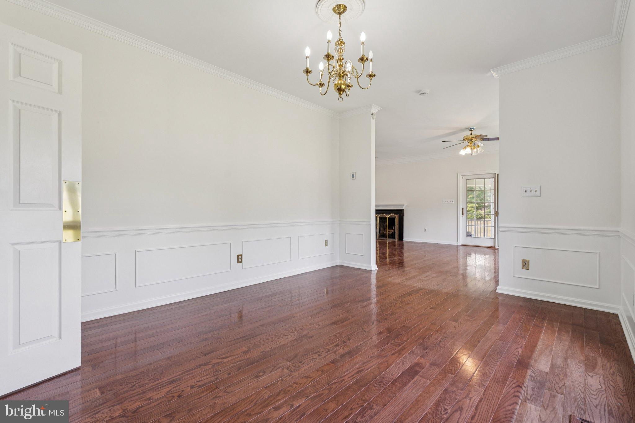 12212 Mt Albert Road Ellicott City, MD 21042 - Photo 14 of 58 wooden floor in an empty room with a window