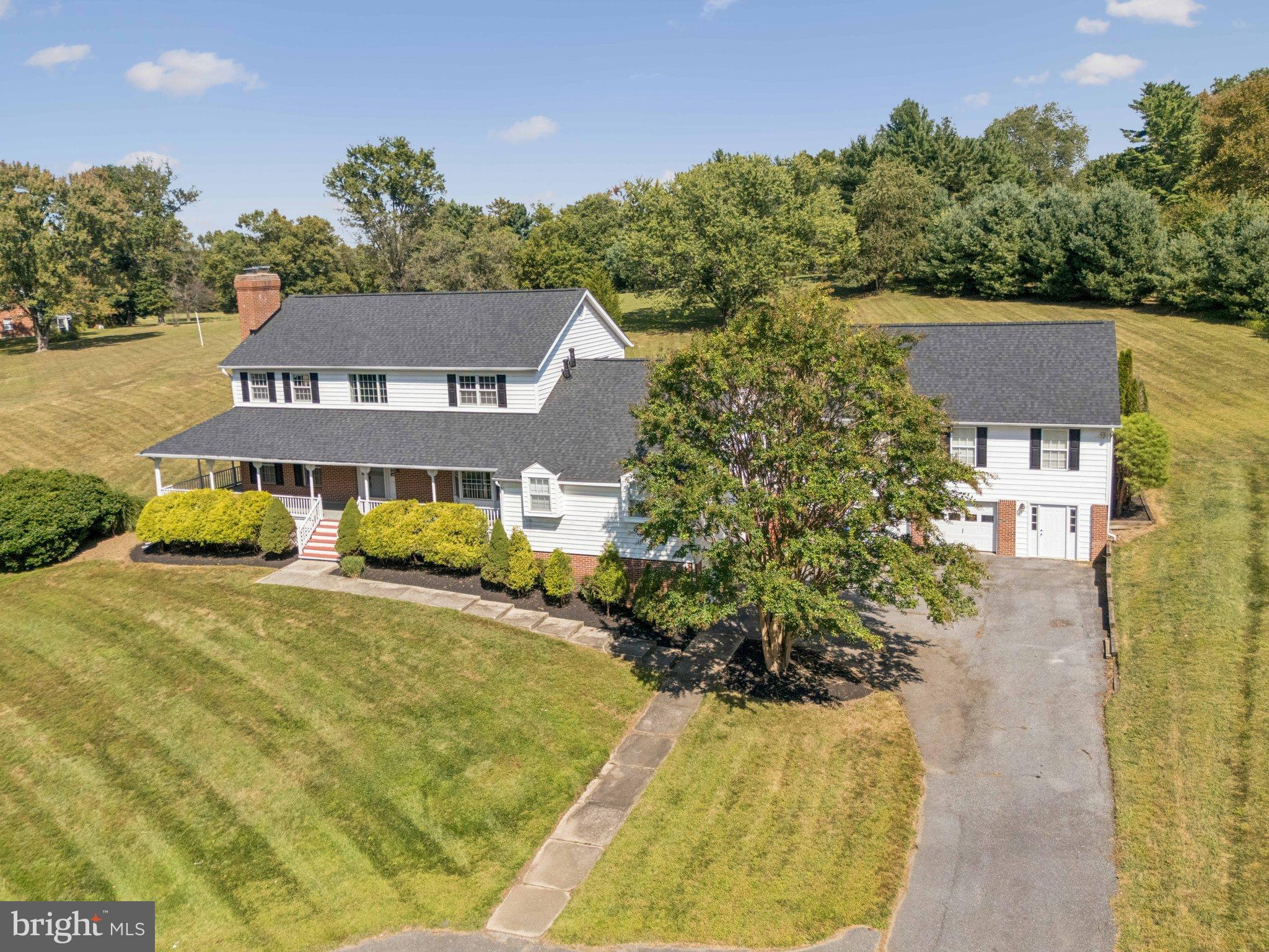 12212 Mt Albert Road Ellicott City, MD 21042 - Photo 2 of 58 a front view of a house with a yard