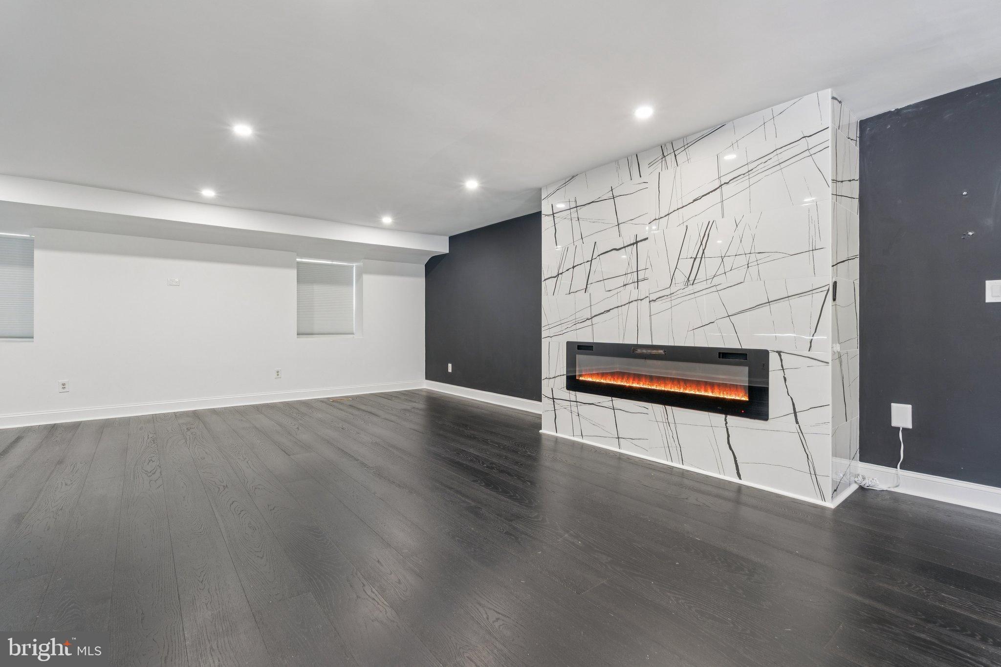 12212 Mt Albert Road Ellicott City, MD 21042 - Photo 21 of 58 a view of an empty room with wooden floor
