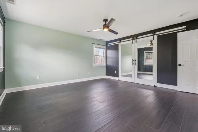 a kitchen with granite countertop white cabinets and sink