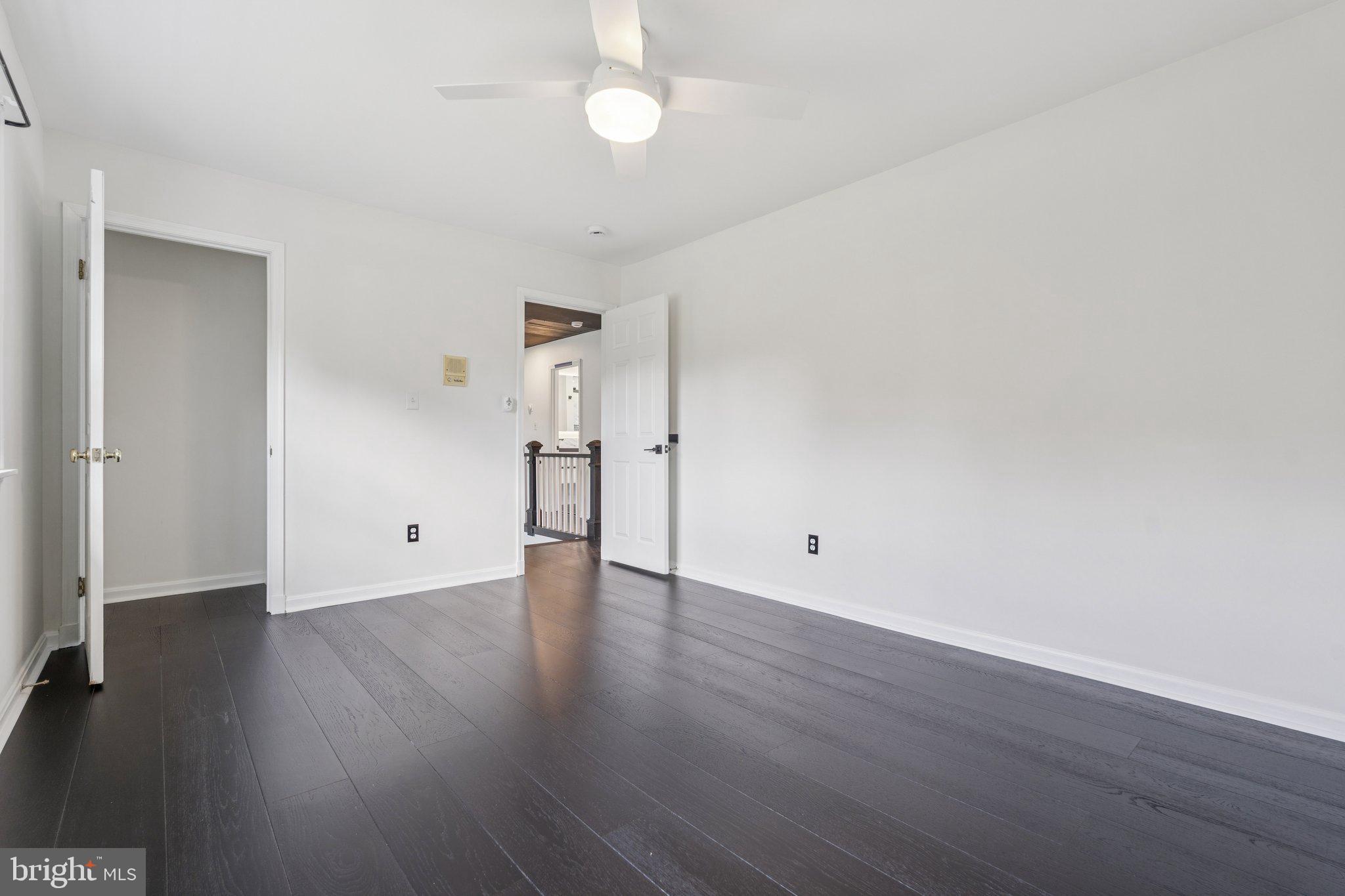 12212 Mt Albert Road Ellicott City, MD 21042 - Photo 34 of 58 an empty room with wooden floor and windows
