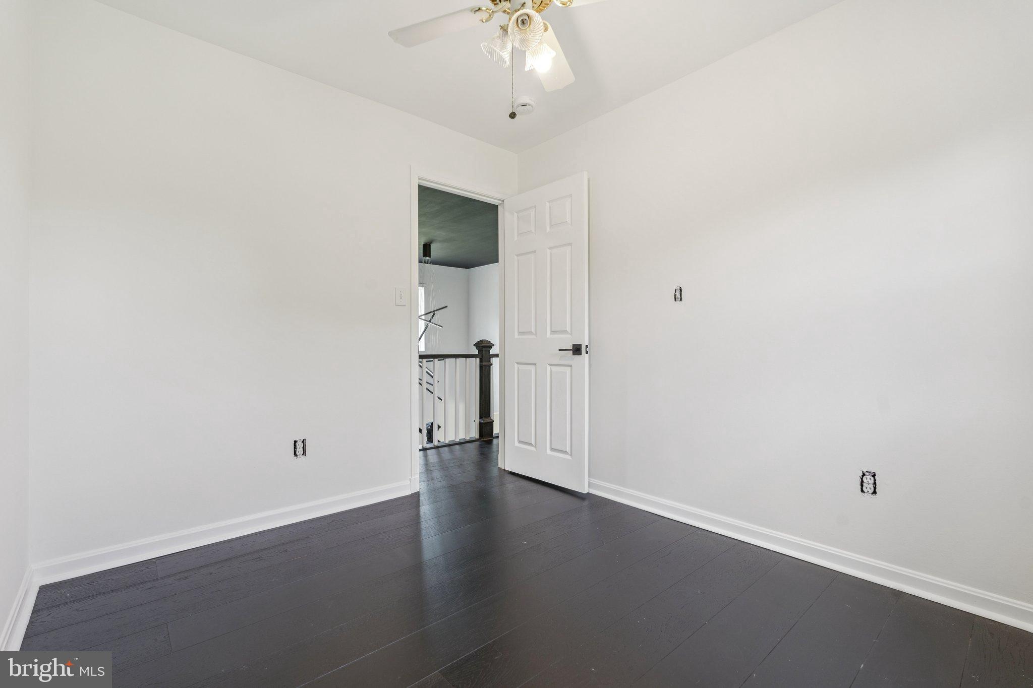 12212 Mt Albert Road Ellicott City, MD 21042 - Photo 38 of 58 wooden floor in an empty room