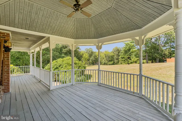a front view of a house with a yard table and chairs