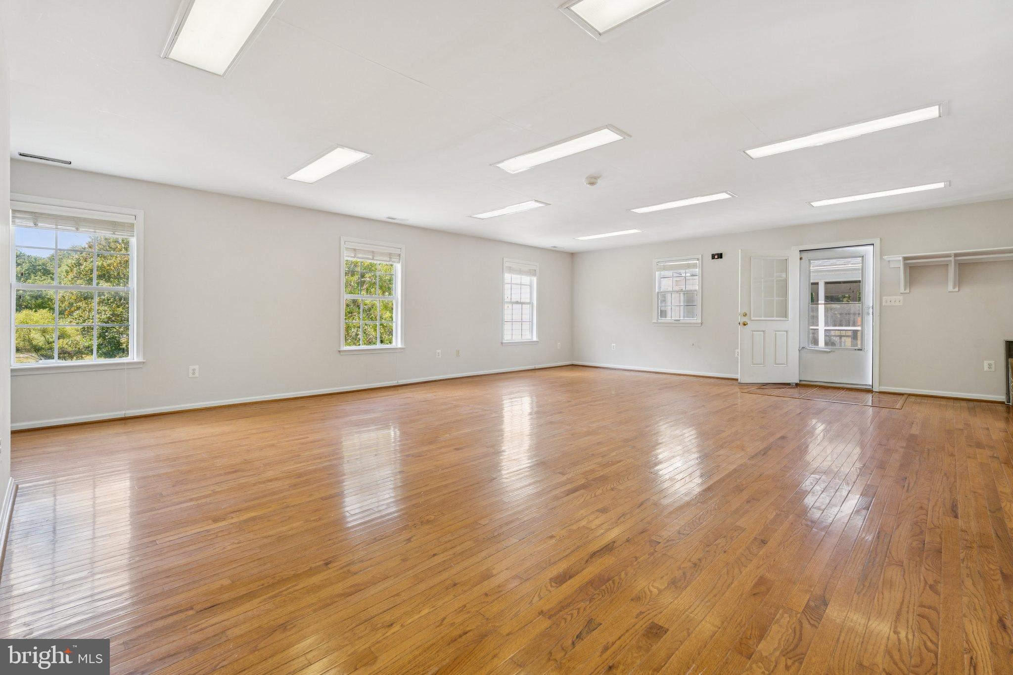 12212 Mt Albert Road Ellicott City, MD 21042 - Photo 47 of 58 a view of empty room with wooden floor and fan