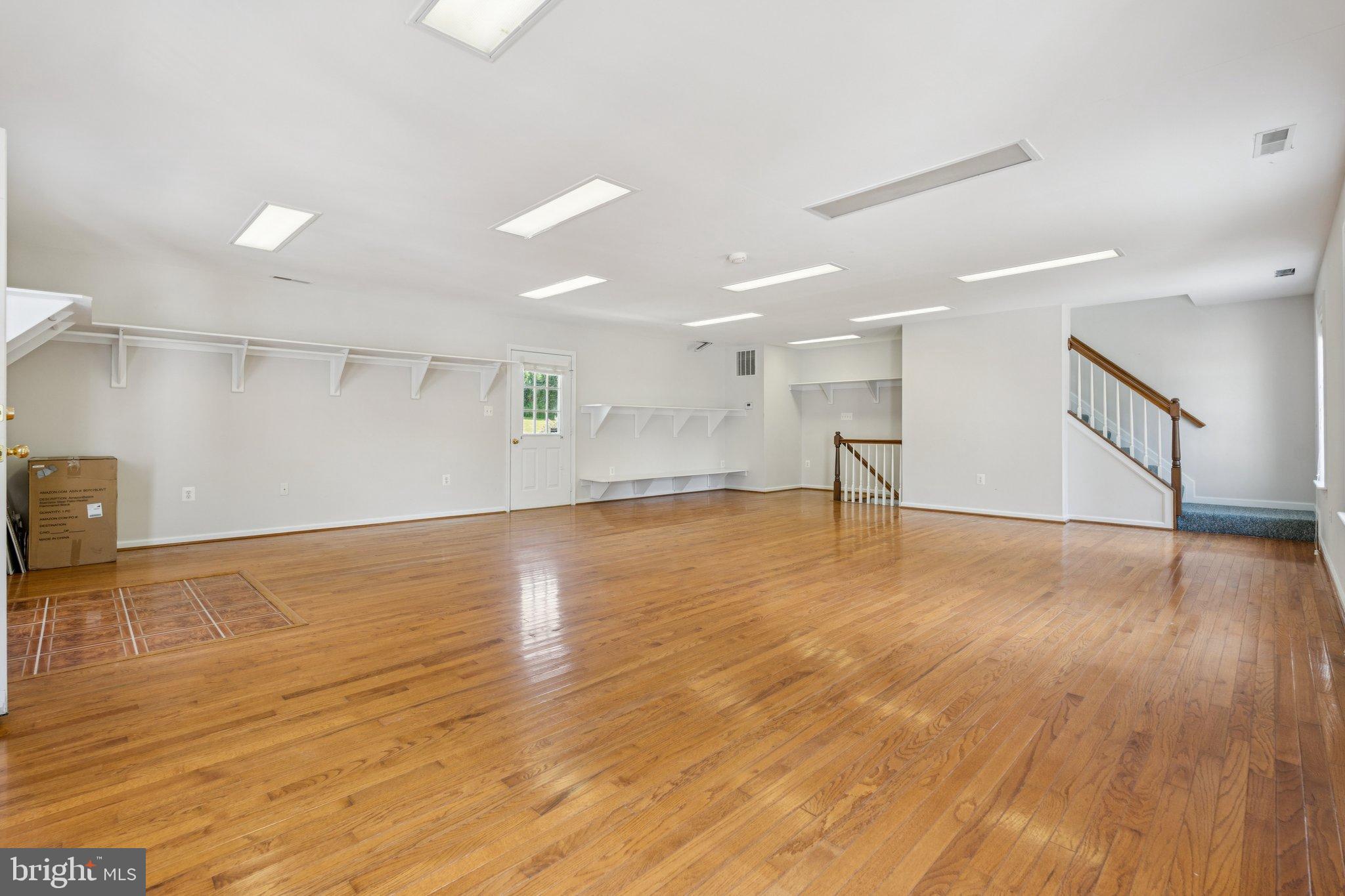 12212 Mt Albert Road Ellicott City, MD 21042 - Photo 49 of 58 a view of empty room with wooden floor