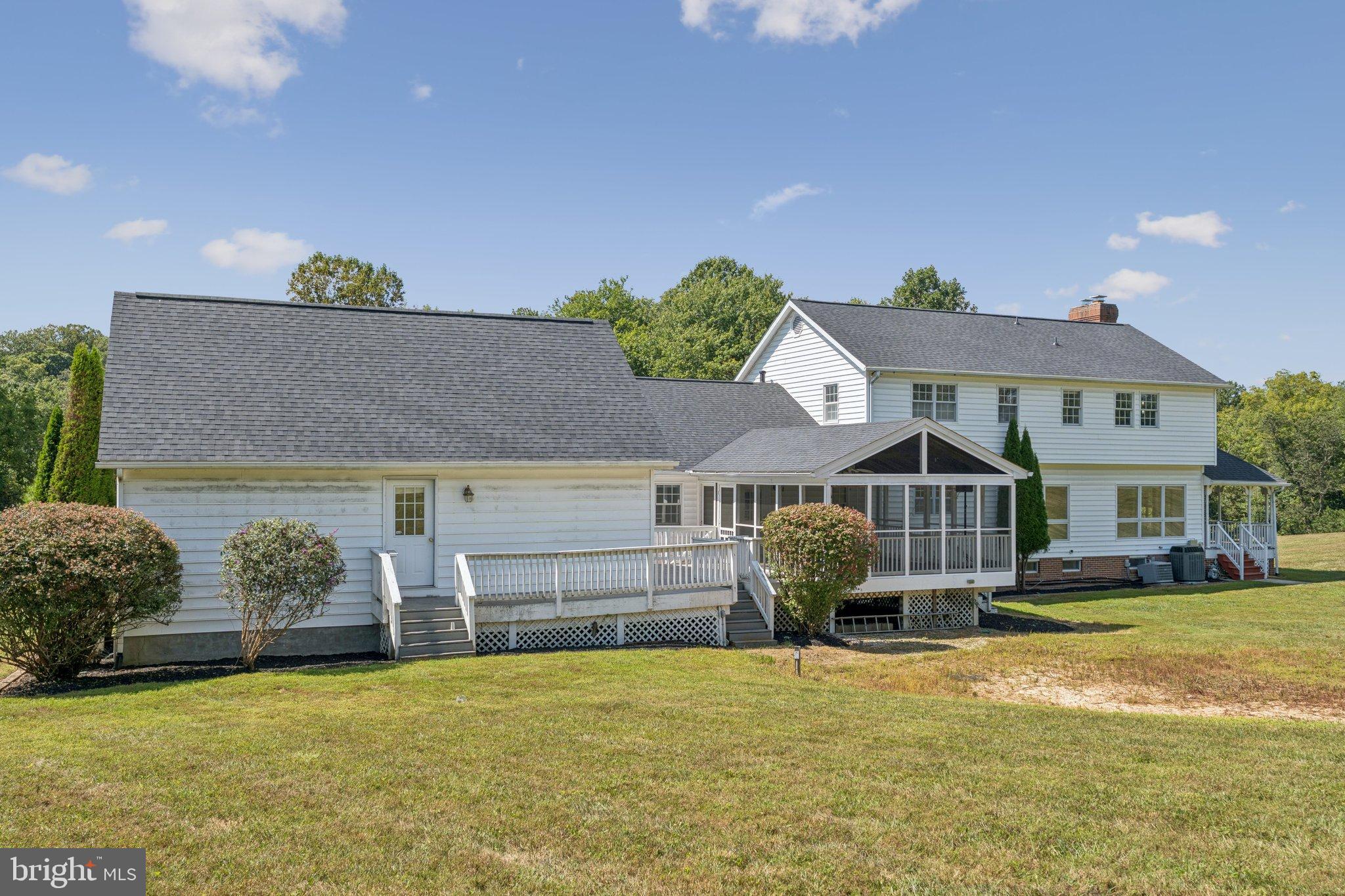 12212 Mt Albert Road Ellicott City, MD 21042 - Photo 53 of 58 a front view of a house with a yard and garage