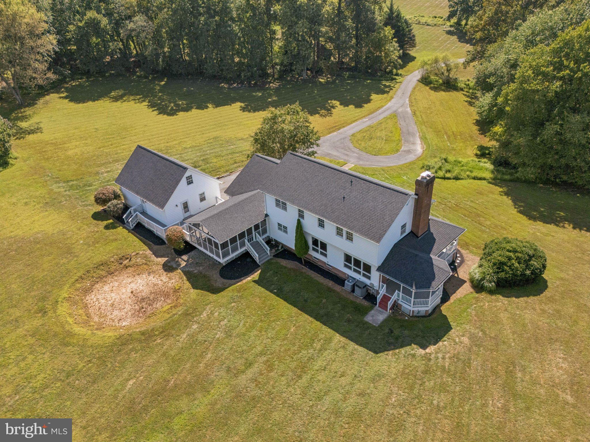 12212 Mt Albert Road Ellicott City, MD 21042 - Photo 54 of 58 an aerial view of a house with swimming pool and lake view