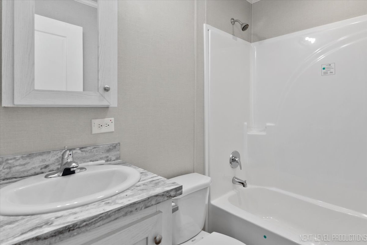 310 Apollo Court Round Lake, IL 60073 - Photo 21 of 38 a bathroom with a sink and a bathtub