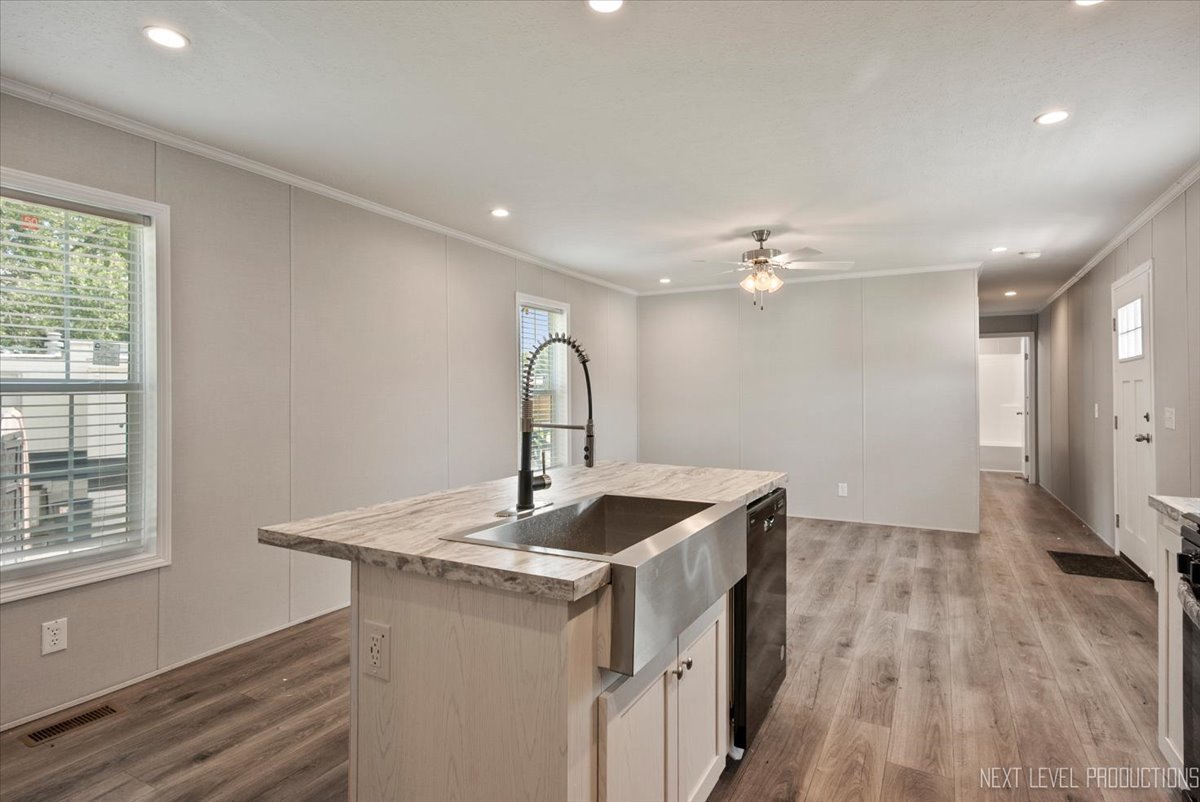 310 Apollo Court Round Lake, IL 60073 - Photo 5 of 38 a kitchen with a sink and chandelier