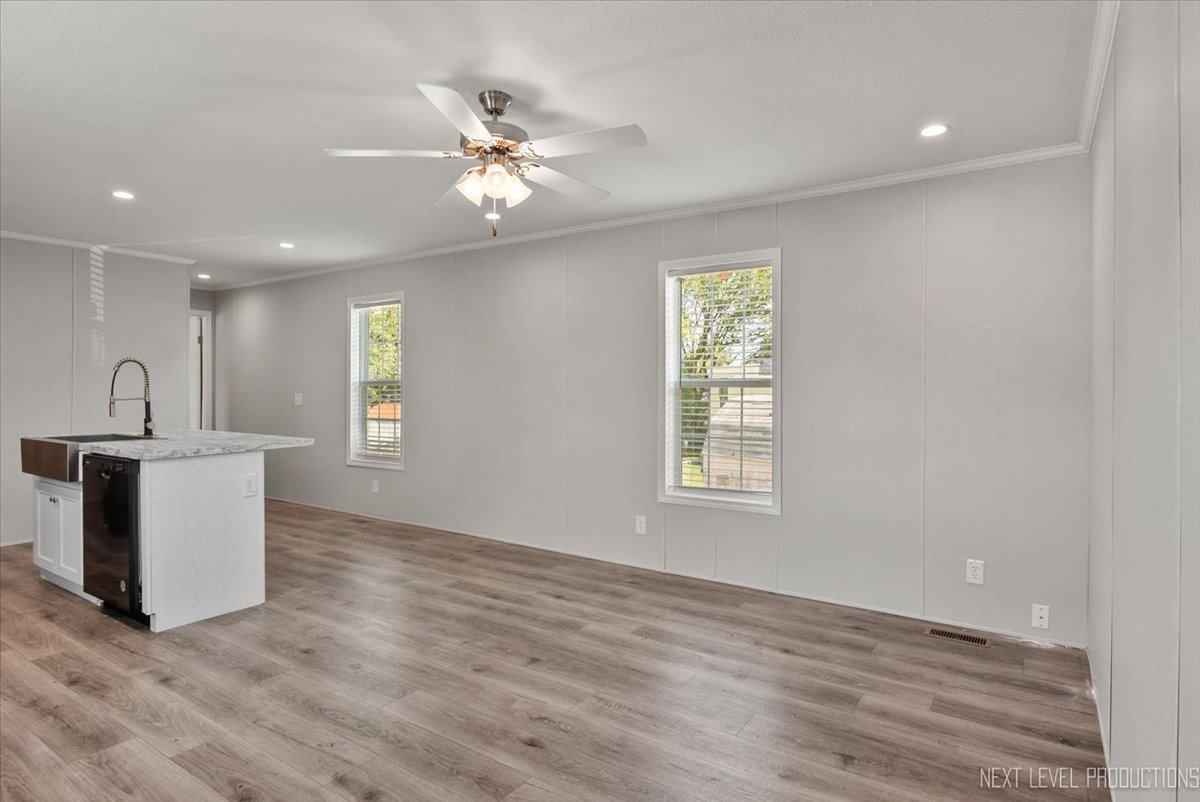 310 Apollo Court Round Lake, IL 60073 - Photo 7 of 38 a view of a room with a window and wooden floor