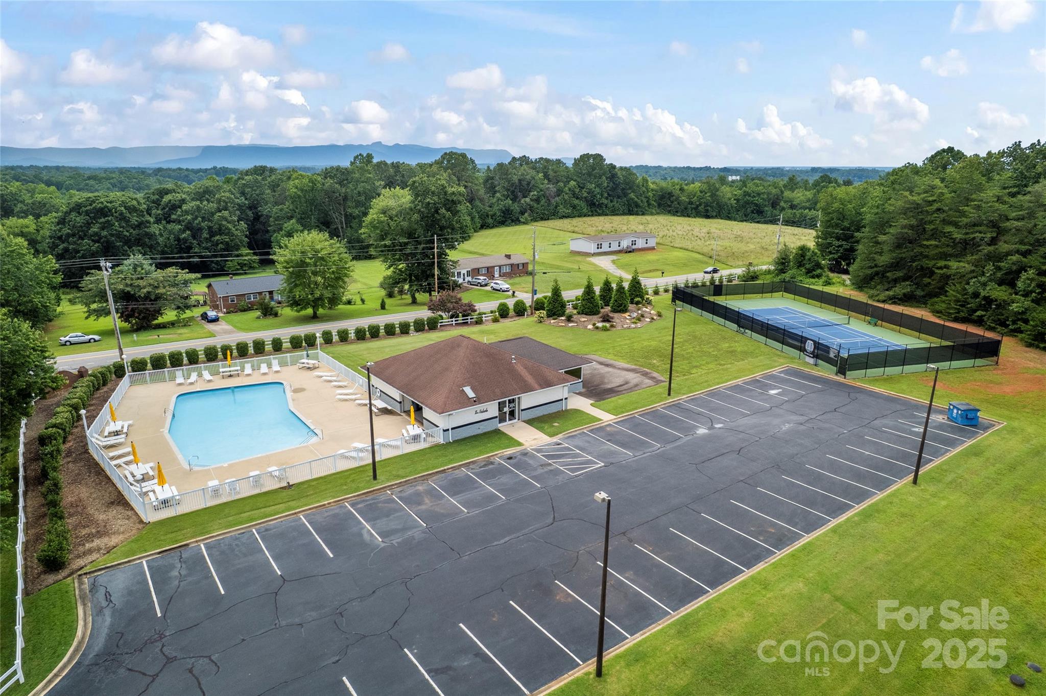 3615 Cornwell Court, Unit 149 Morganton, NC 28655 - Photo 16 of 20 a view of a tennis ground with large trees