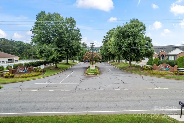 a view of park with large trees