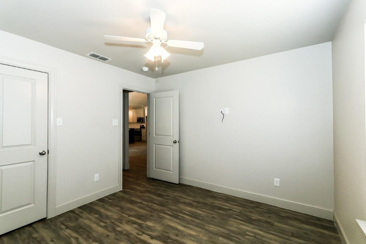 3811 133rd Street Lubbock, TX 79423 - Photo 11 of 12 a view of an empty room with wooden floor