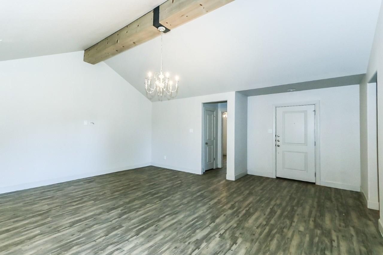 3811 133rd Street Lubbock, TX 79423 - Photo 12 of 12 a view of an empty room with wooden floor