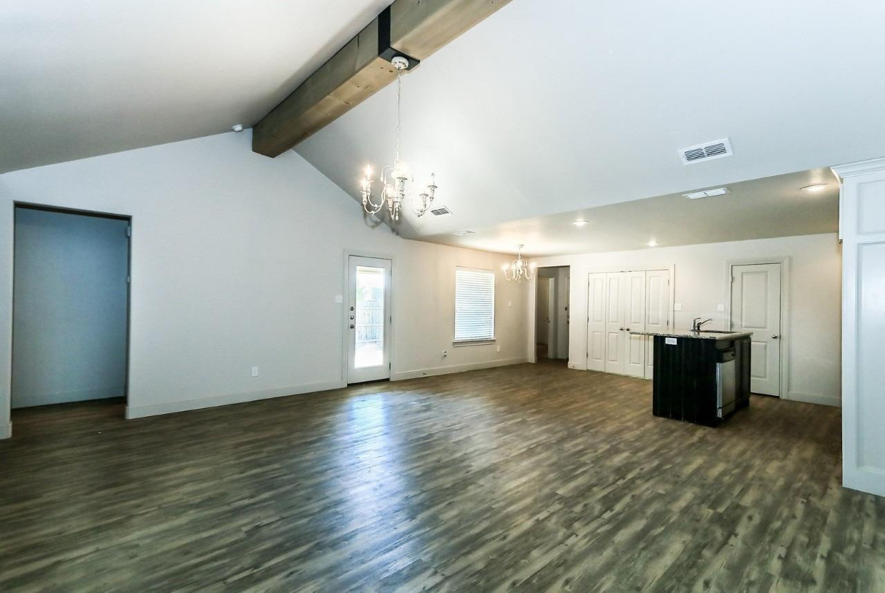 3811 133rd Street Lubbock, TX 79423 - Photo 2 of 12 a view of a livingroom with wooden floor