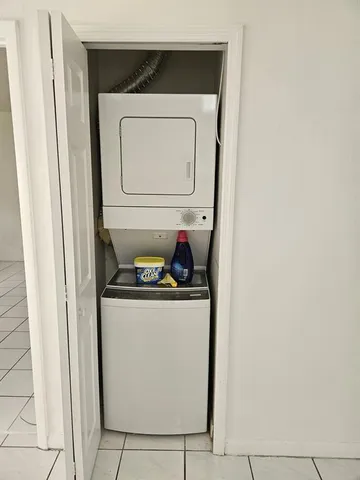 a utility room with washer and dryer