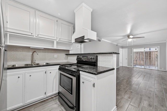 1418 Vermont Street, Unit 3 Houston, TX 77006 - Photo 2 of 14 a kitchen with granite countertop a sink stainless steel appliances and cabinets