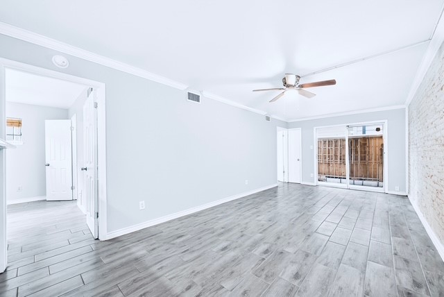 1418 Vermont Street, Unit 3 Houston, TX 77006 - Photo 4 of 14 wooden floor in an empty room with a window