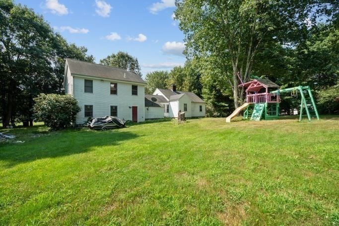 17 Everett Street Sherborn, MA 01770 - Photo 13 of 22 a view of a house with backyard and garden