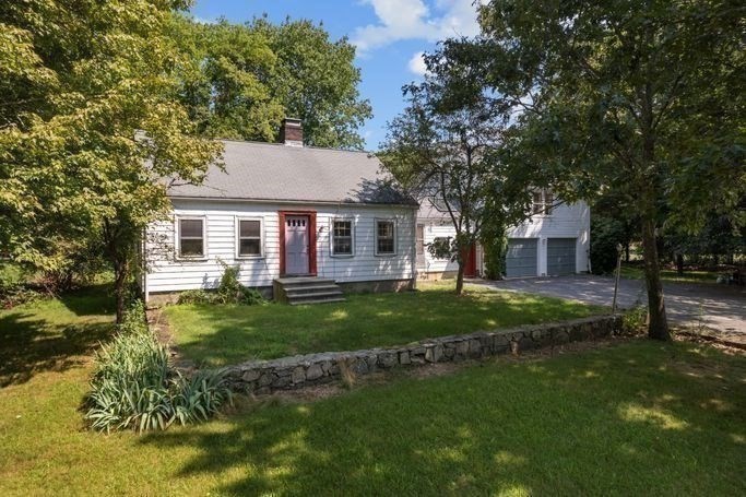 17 Everett Street Sherborn, MA 01770 - Photo 15 of 22 a front view of a house with a yard
