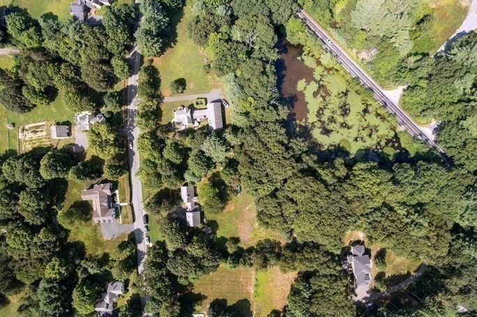 17 Everett Street Sherborn, MA 01770 - Photo 18 of 22 a aerial view of a house with a yard and lake view