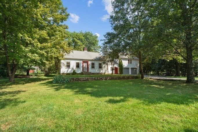 17 Everett Street Sherborn, MA 01770 - Photo 6 of 22 a front view of a house with a yard