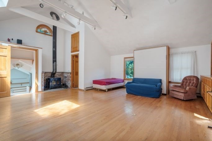 17 Everett Street Sherborn, MA 01770 - Photo 10 of 22 a living room with furniture and a wooden floor