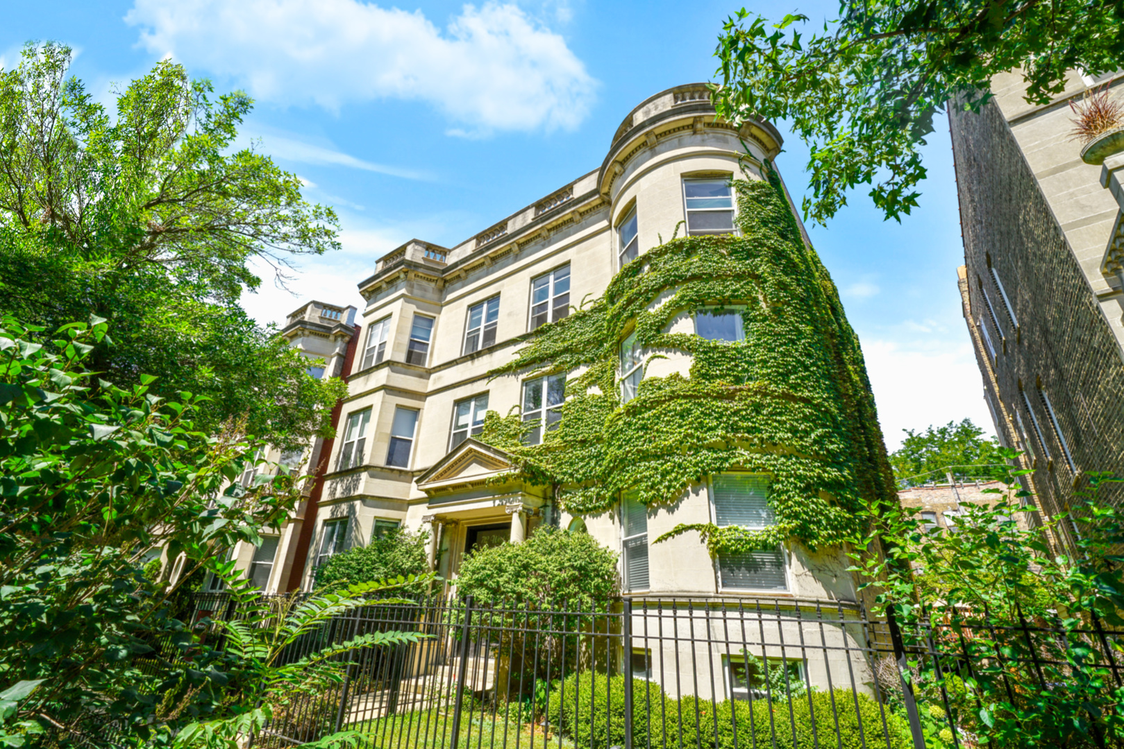 an aerial view of a multi story residential apartment building