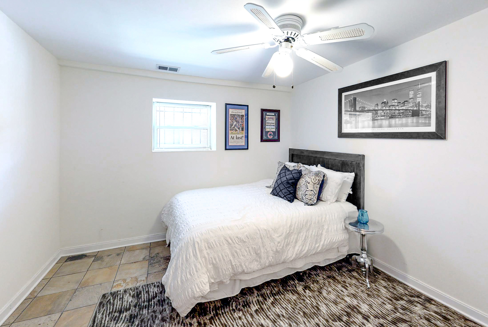 712 West Roscoe Street, Unit 3D Chicago, IL 60657 - Photo 15 of 23 a bedroom with bed and painting on the wall