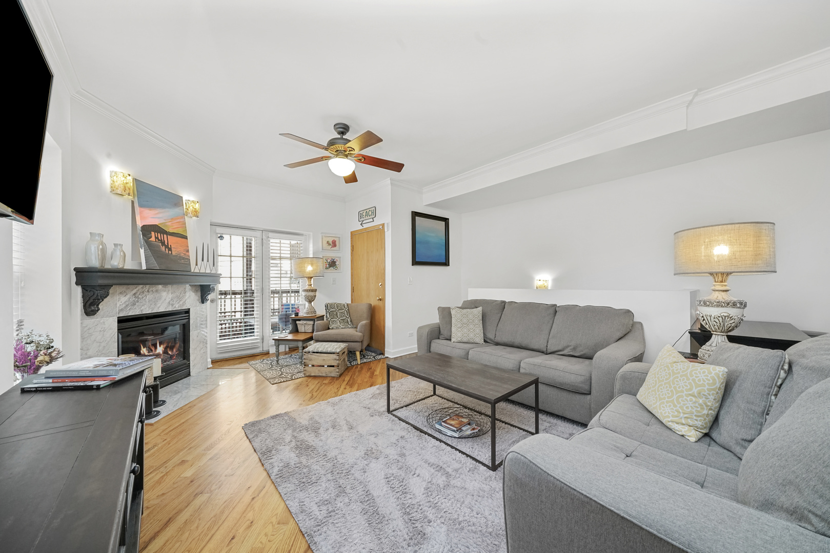 712 West Roscoe Street, Unit 3D Chicago, IL 60657 - Photo 6 of 23 a living room with furniture and a fireplace
