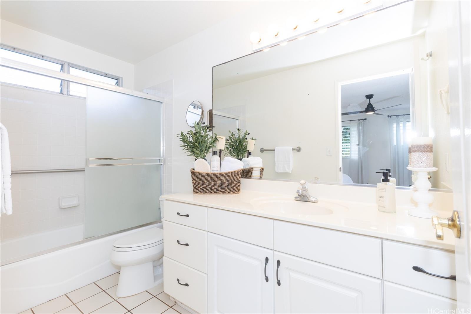 176 Kuulei Road Kailua, HI 96734 - Photo 9 of 25 Primary bathroom with plenty of counter space and bathtub.